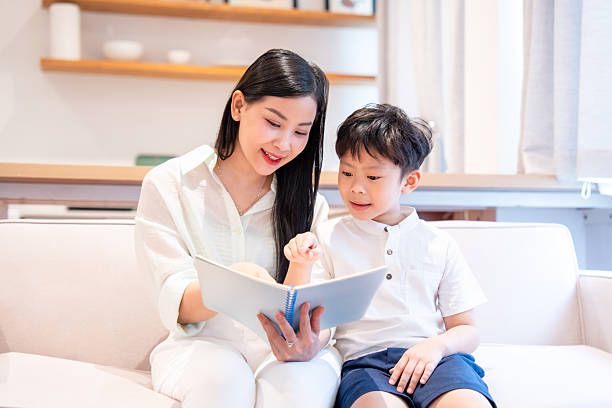 istock Mother and son share a special moment while reading a book together fostering learning and bonding 2220699389