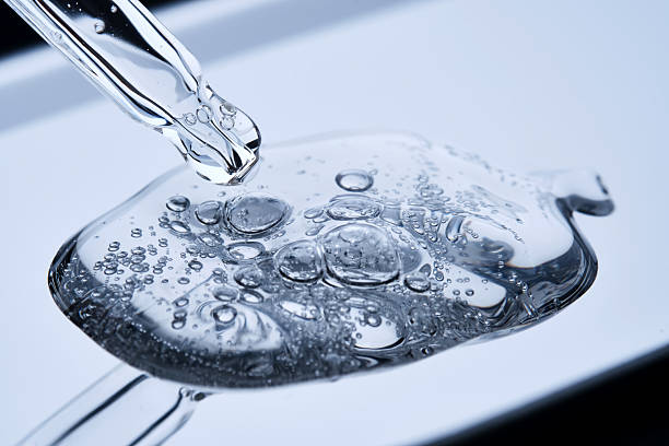 istock The texture of the serum with bubbles spilling onto the blue surface. 2220699718