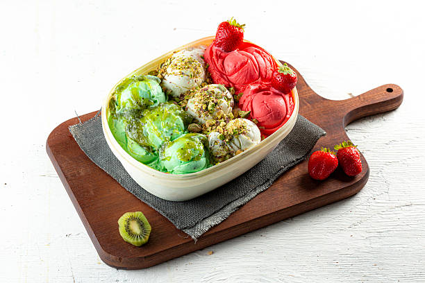 Tropical fruit ice cream tub, kiwi and strawberry.