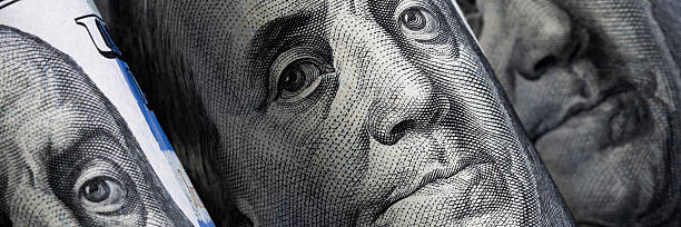 istock Portrait of Benjamin Franklin on U.S. $100 Currency Bill 2220702080