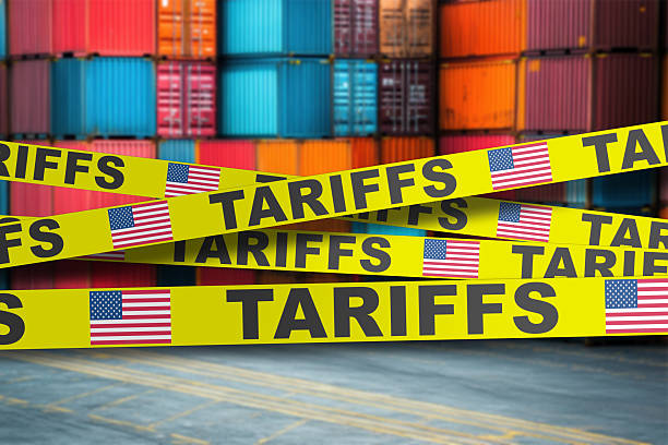 istock Shipping containers sealed with US tariff warning tape 2220702081