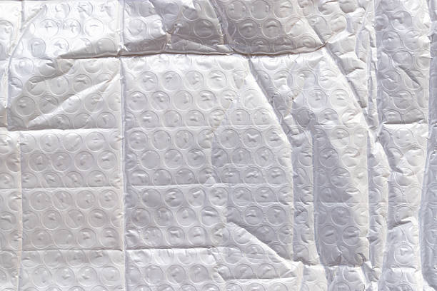 white packaging film with folds and wrinkles, abstract background