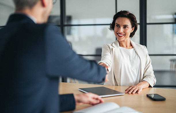 istock Successful business agreement sealed with a handshake in modern office 2220703090