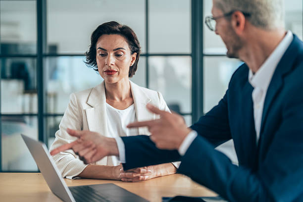 istock Professional business discussion in modern office environment 2220703098