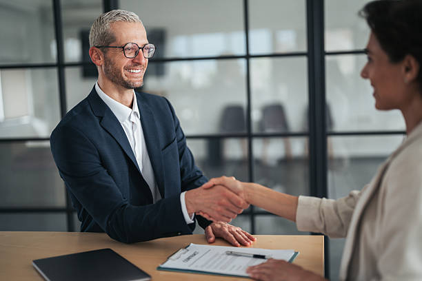 istock Successful business agreement sealed with a handshake in modern office 2220703123