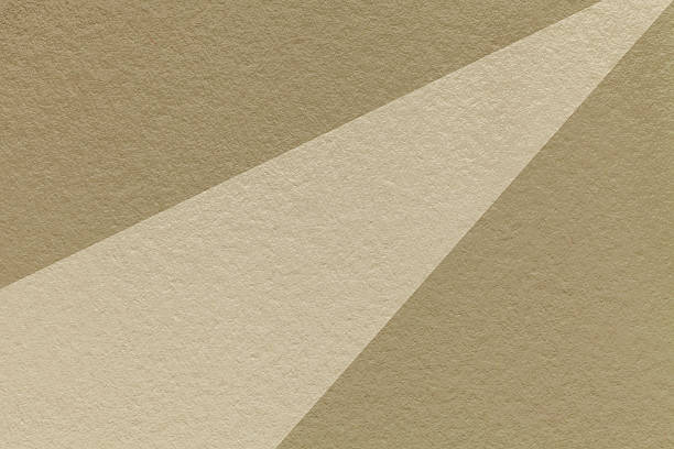 Abstract old geometric brown paper background with beige rays, macro texture for banner, template, presentation.