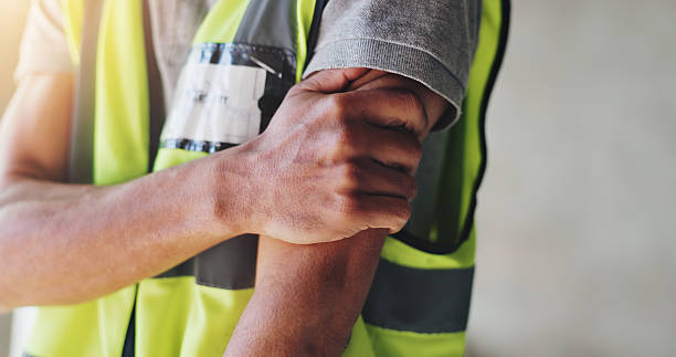 istock Hands, construction worker and shoulder pain for renovation, project and arthritis with injury at site. Person, engineer and builder with burnout, muscle fatigue or tired with massage for relief 2220706691