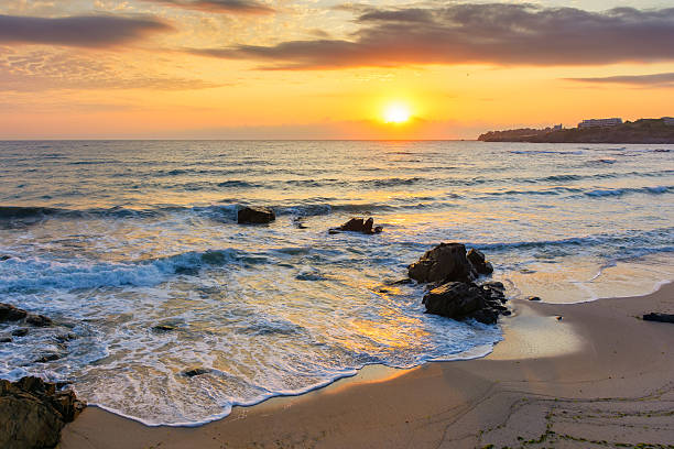 istock sunrise at the beach with gorgeous sky 2220707131