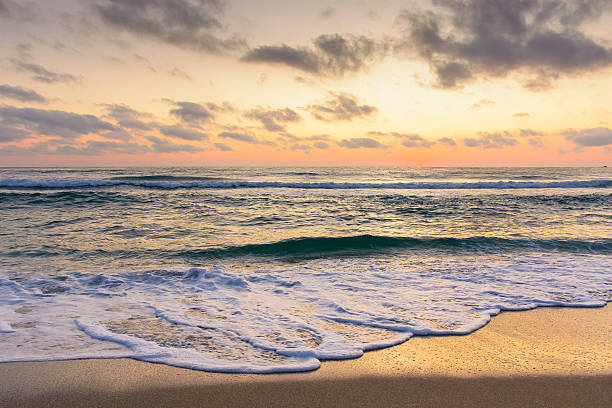 istock sea wave touch the sand beach at dawn 2220707255