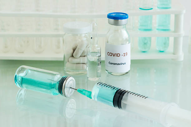 istock Glass bottle with injector on glass table 2220709866
