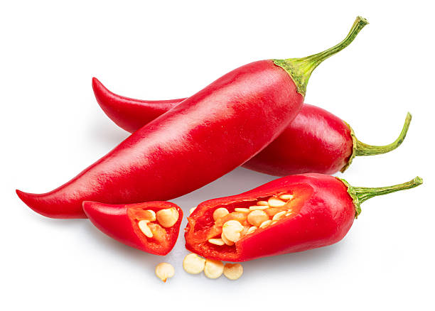 istock Fresh red chilli peppers and chilli slices and seeds isolated on white background. File contains clipping paths. 2220709917