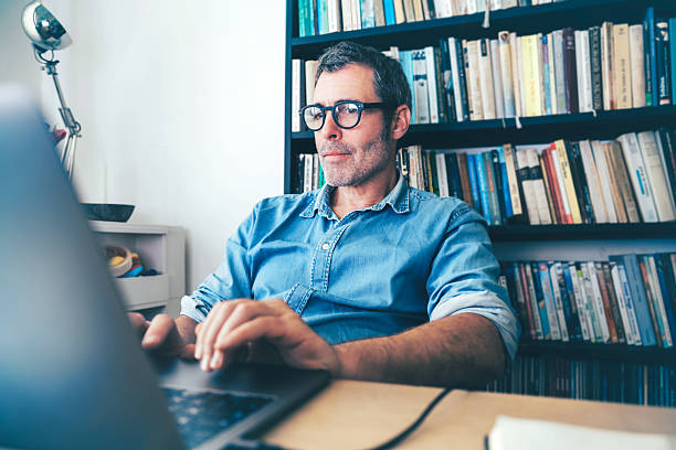 istock man working at laptop at desk 2220714404