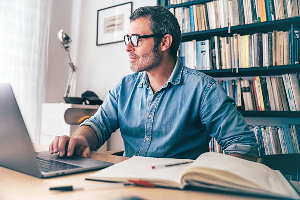 istock man working at laptop at desk 2220714422