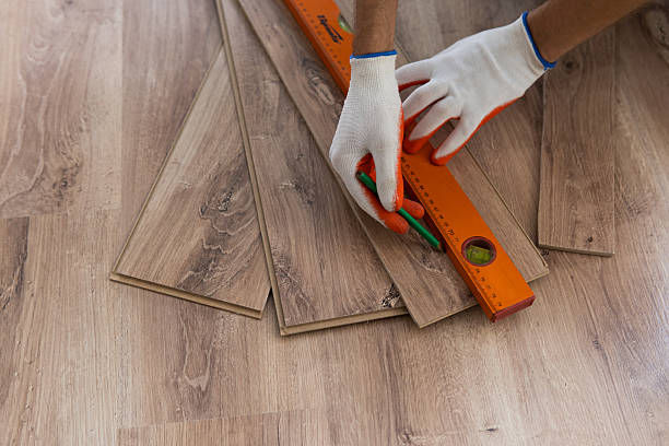 istock Laminate Flooring Improvement. Installer Contractor Installing New Floor. 2220715678