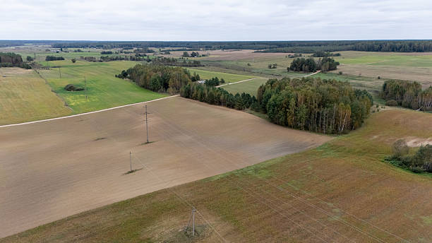 istock Aerial View of Rural Fields and Power Lines 2220715719