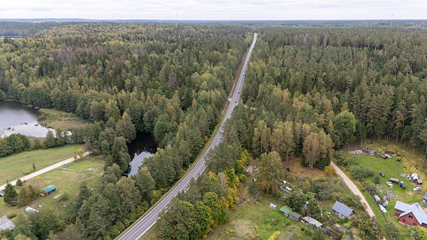 istock Aerial View of Winding Road Through Forest 2220715918