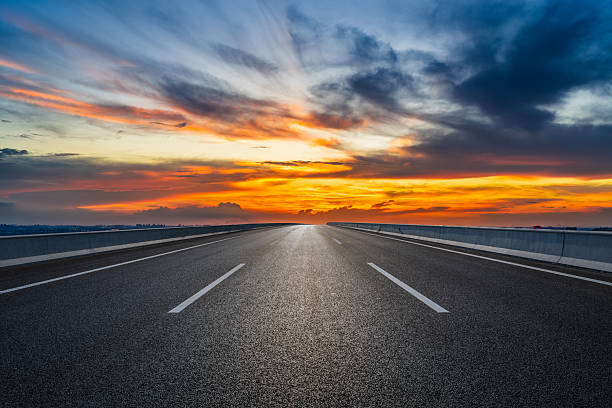 istock Asphalt highway road and beautiful sky clouds at sunset 2220716083