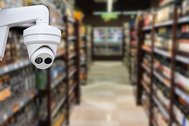 istock CCTV camera system security in shopping mall supermarket blur background.,Abstract background with Blurred people and shopping center. 2220716815