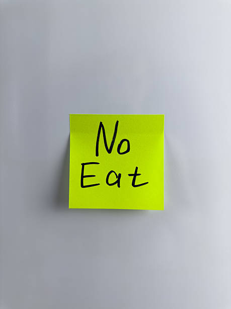 istock Sign on white background prohibiting eating 2220717052
