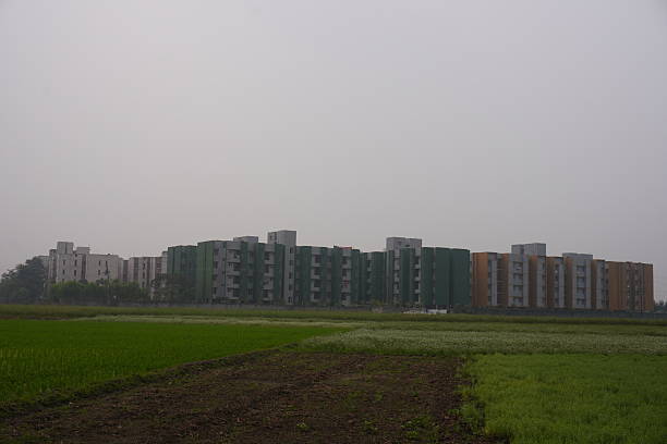 istock A high-tech city has been built beside the green field 2220717056