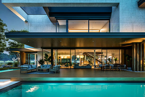 istock 3d rendering of two-story house with concrete facade in night 2220720253