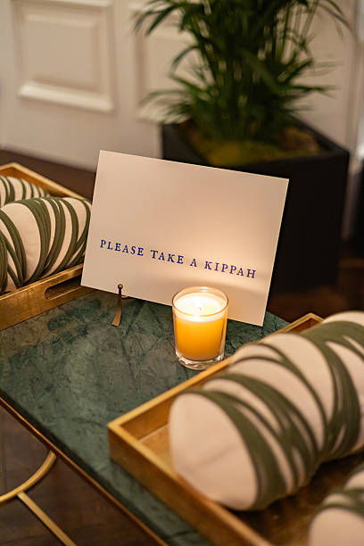 istock Kippah Welcome Table with Candles and Ceremony Sign 2220722946