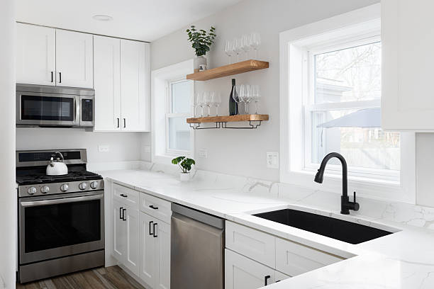 istock A white kitchen with stainless steel appliances. 2220723739