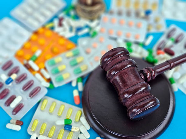 istock Legal implications of pharmaceutical regulations highlighted by a gavel and assorted medications 2220724281