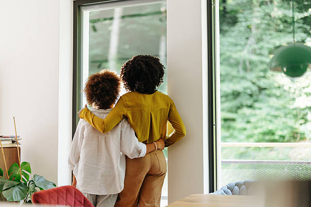 istock Black Mom and Child Enjoying Nature Through Window 2220724704
