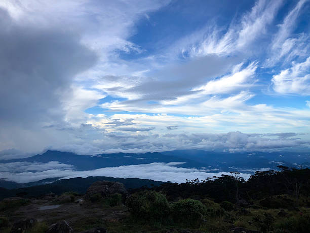 istock Panoramic Mountain Vista Above a Sea of Clouds 2220731609