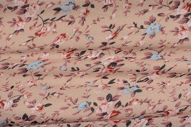 istock Synthetic Polyester Fabric with Bright Flower Print Close-Up 2220735539