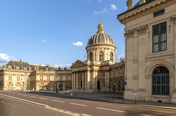 istock Institut de France with classical dome lit by sunset in Paris 2220735625