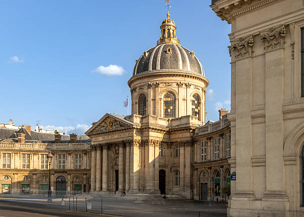 istock Institut de France with classical dome lit by sunset in Paris 2220735731