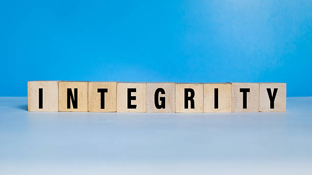 istock integrity word text on wooden blocks on blue background 2220735762