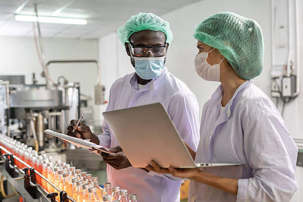 istock quality inspector food or beverages technician inspection about quality control food or beverages before send product to the customer. Production leader recheck ingredient and productivity. 2220738249