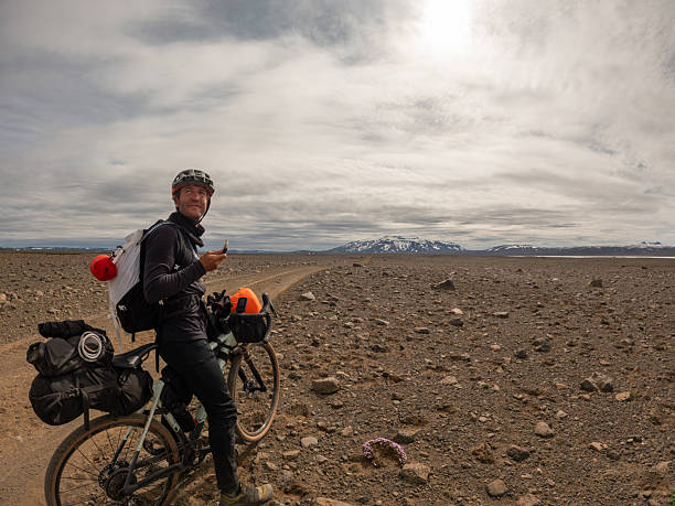 istock Cyclist Enjoying a Snack on Rocky Desert Road 2220739868