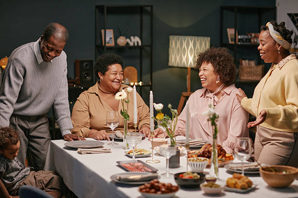 istock Happy Black Family Sharing Festive Dinner in Dining Room 2220740254