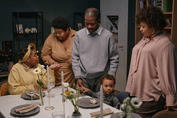 Family Chatting while Gathering around Dining Table at Home