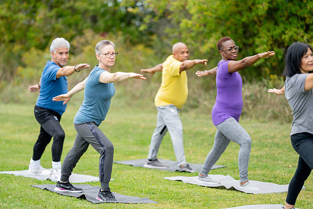 istock Group of Seniors Practicing Yoga Outdoors in a Peaceful Park Setting 2220740511