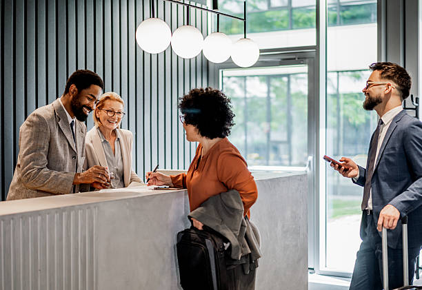 istock Businesswoman checking in at hotel reception 2220741258