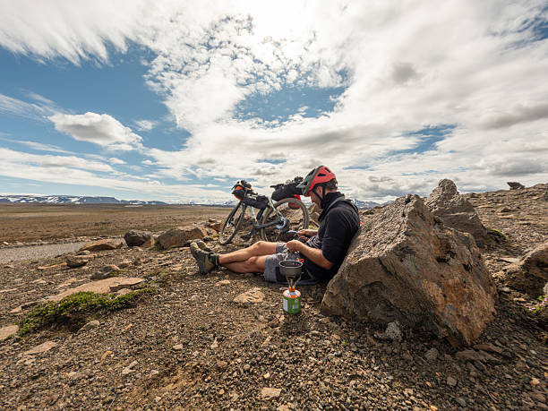 istock Cyclist Resting and Cooking on Rocky Terrain 2220741405
