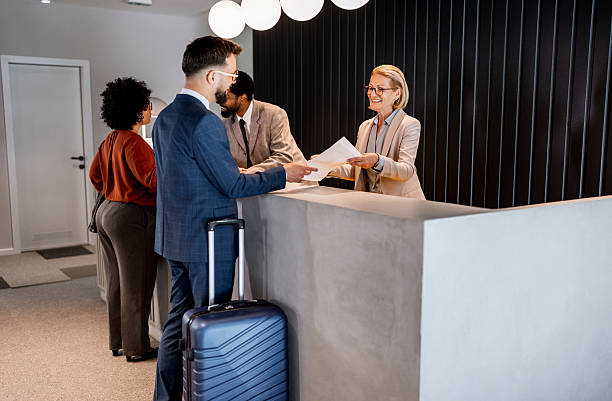 istock Businessman checking in at hotel reception 2220741598