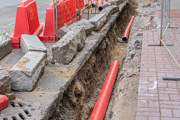 istock Road repairs, pipe, pile of sand. 2220742940
