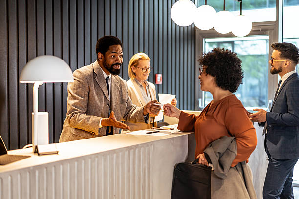 istock Businesswoman checking in at hotel reception 2220743210