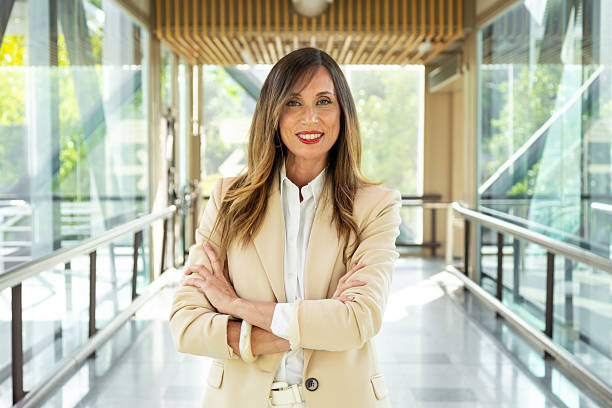 istock Successful businesswoman smiling with confidence in modern office 2220744708