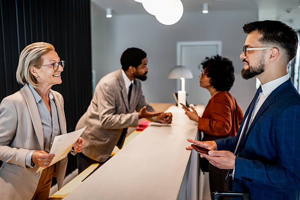 istock Businesswoman checking in at hotel reception 2220744918
