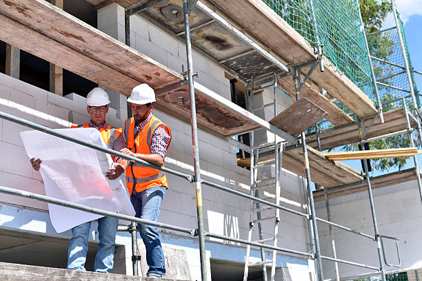 istock construction manager and architect on site during the construction of a house - planning and control on site - teamwork 2220746189