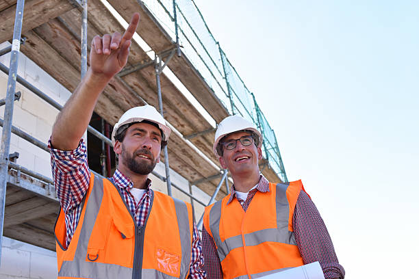 istock teamwork on the construction site - site manager and architect on site during the construction of a house 2220746925
