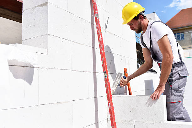 istock profession construction worker - work on a building site construction of a residential house 2220747282