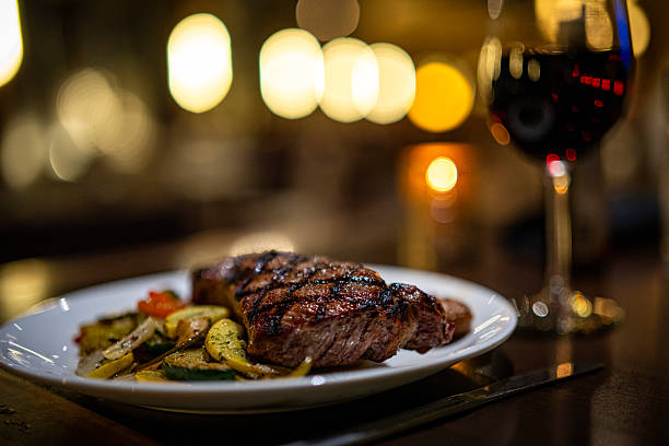 istock Charcoal-grilled beef steak with grilled vegetables 2220748194